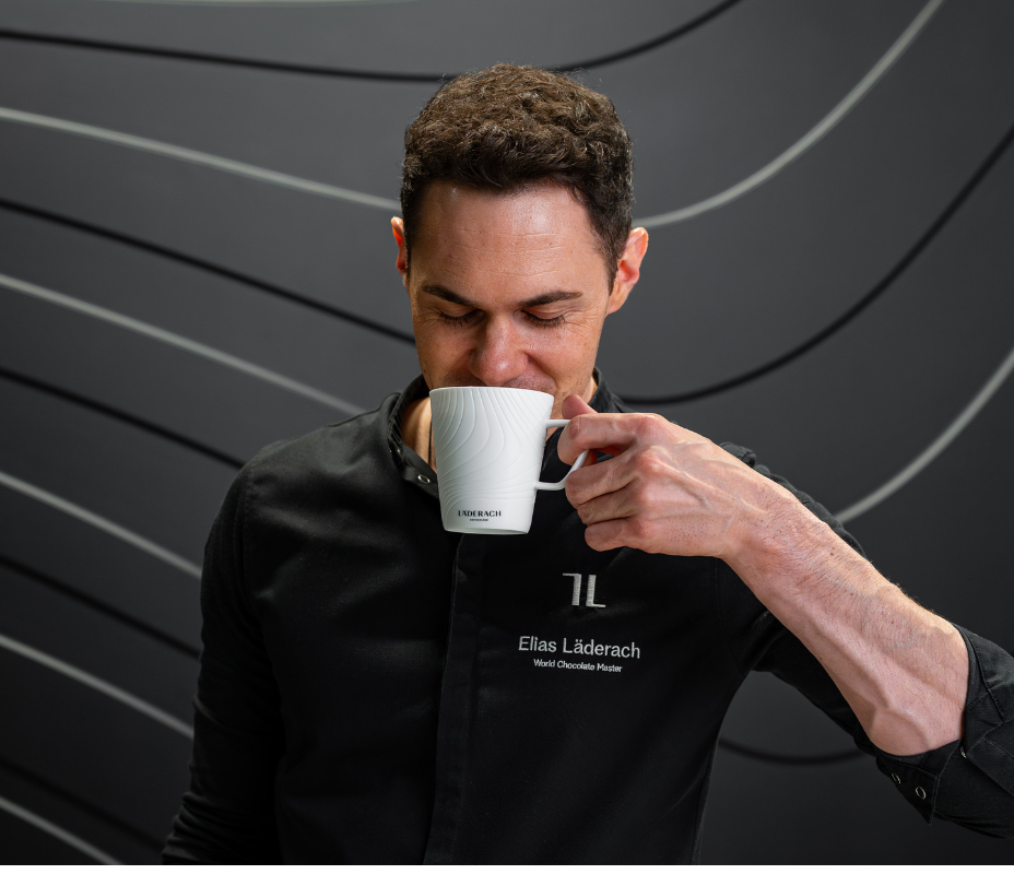 A finished cup of Läderach hot chocolate, ready to drink